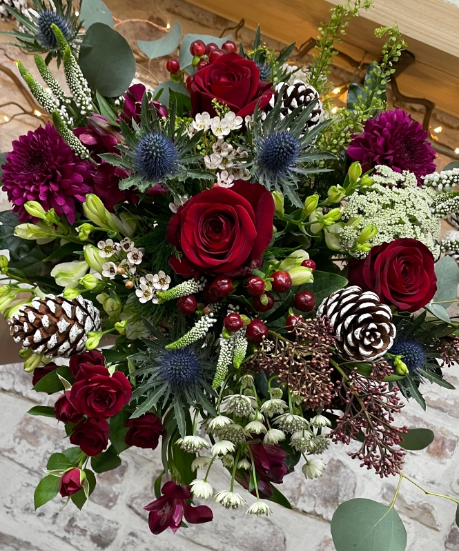 Luxury Christmas hand tied bouquet presented in a gift box in water.