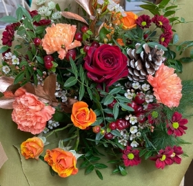 Florists choice gift boxed Christmas bouquet in water.