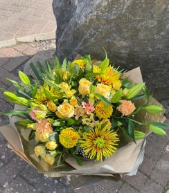 Large luxury golden bouquet hand tied and presented in a gift box with water.