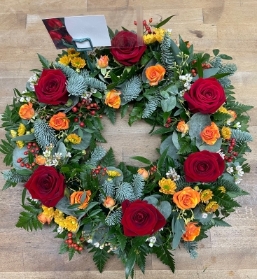 Red rose festive wreath in oasis